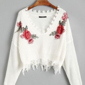A never worn before cropped sweater